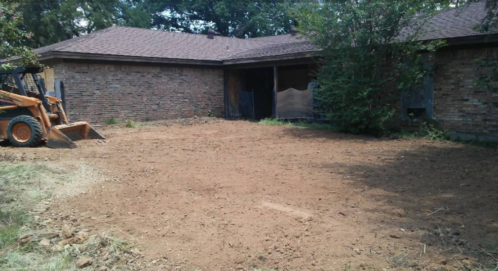 backyard after demolishing a pool and filling in with dirt