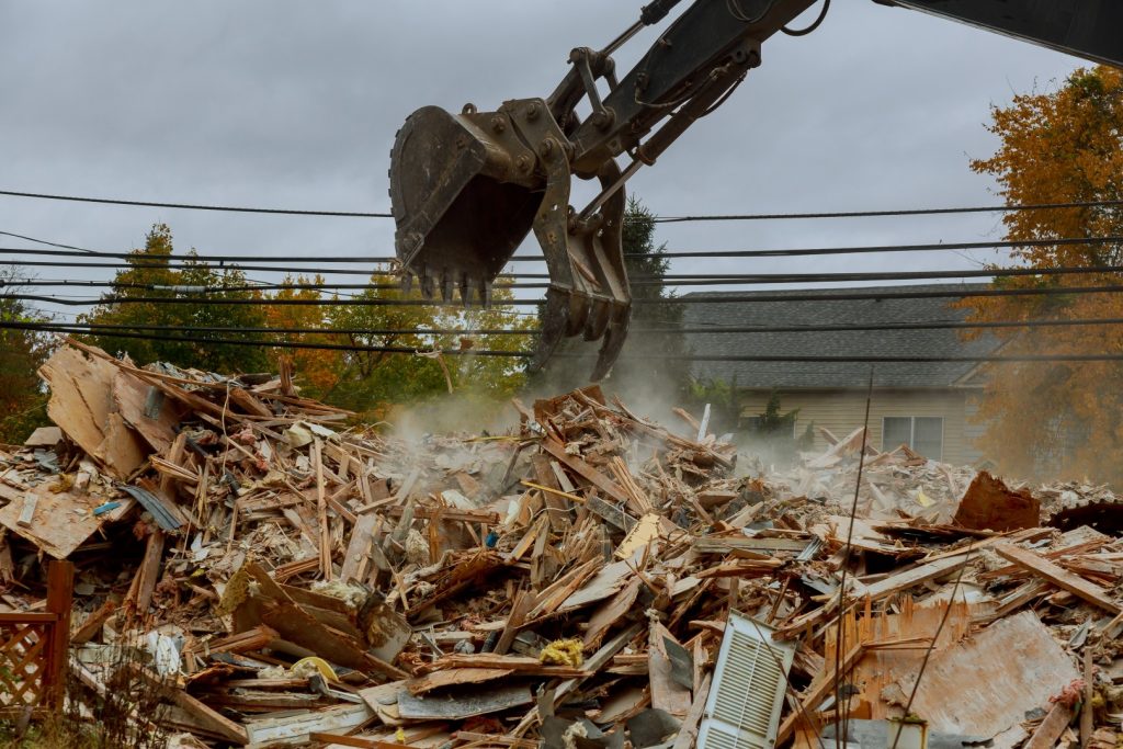 construction vehicle demolishing a building